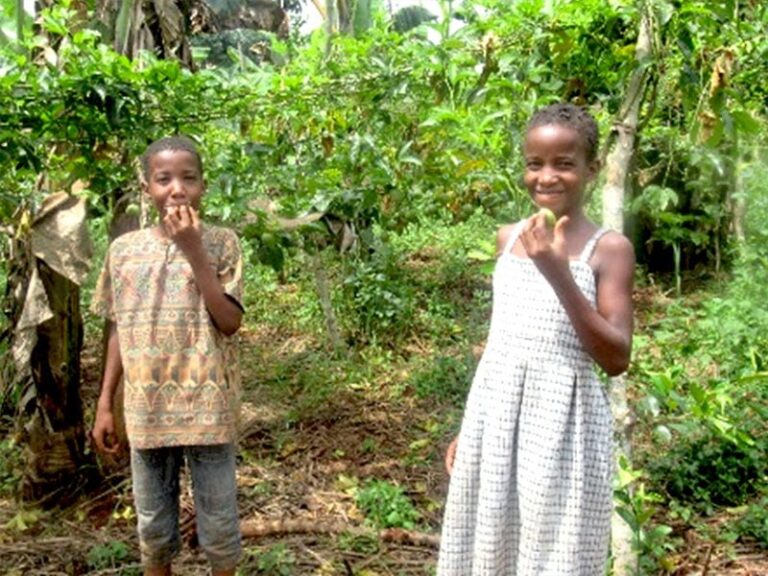 Eli and Emma take a break to enjoy some of the fruits of their labors.