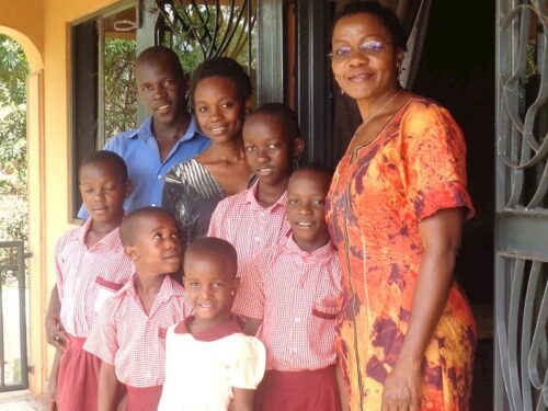 Anne and Students on Porch of Global Village Childrens Project Schoolhouse