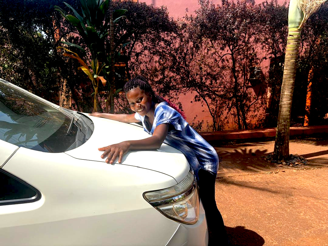 Sophia and the new van that was a gift of love from the supporters of GVCP